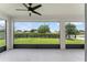Relaxing screened-in patio offering a view of the expansive green backyard and lush landscaping at 3866 Cabo Rojo Dr, St Cloud, FL 34772