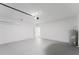 Large garage with painted floors, overhead lighting, and water heater at 5119 Sw 165Th Pl, Ocala, FL 34473