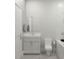 The bathroom showcases a modern vanity, toilet, and bathtub, highlighting functionality and efficient use of space at 5381 Sw 128Th Street Rd, Ocala, FL 34473