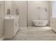 Elegant bathroom features a soaking tub, double sink vanity, and modern fixtures at 5381 Sw 128Th Street Rd, Ocala, FL 34473