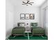 The twin beds, soccer-themed decor, ceiling fan, and natural light create a sporty and inviting atmosphere at 5381 Sw 128Th Street Rd, Ocala, FL 34473