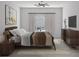 Comfortable bedroom with a ceiling fan, natural light and neutral decor at 5381 Sw 128Th Street Rd, Ocala, FL 34473