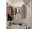 Organized walk-in closet with hanging racks, shoe storage, and ample space for clothing and accessories at 5381 Sw 128Th Street Rd, Ocala, FL 34473