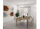 Bright and airy dining room featuring modern art and natural light. Perfect for entertaining guests at 5381 Sw 128Th Street Rd, Ocala, FL 34473