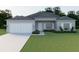 Charming single-story home features a two-car garage, landscaped yard, and a welcoming front entrance at 5381 Sw 128Th Street Rd, Ocala, FL 34473