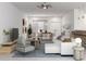 Stylishly furnished living area with an open floor plan, dining area and modern decor at 5381 Sw 128Th Street Rd, Ocala, FL 34473