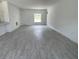 Spacious living area with tile flooring and ample natural light. Ready for your personal touch! at 5381 Sw 128Th Street Rd, Ocala, FL 34473