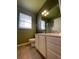 Bathroom features a vanity with cabinet storage, toilet, and large mirror at 6434 Cava Alta Dr # 401, Orlando, FL 32835