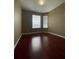 Bedroom with multiple windows and hardwood floors at 6434 Cava Alta Dr # 401, Orlando, FL 32835
