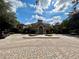 Exterior view of the community clubhouse at 6434 Cava Alta Dr # 401, Orlando, FL 32835