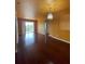 Spacious living room featuring hardwood floors and stylish chandelier at 6434 Cava Alta Dr # 401, Orlando, FL 32835