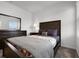 Well-appointed bedroom featuring a dresser with mirror, a nightstand, and natural light at 6458 Pine Warbler Way, St Cloud, FL 34771