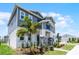 Attractive two-story home with a well-kept lawn and colorful landscaping at 6458 Pine Warbler Way, St Cloud, FL 34771