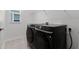 Laundry room with modern washer and dryer set and convenient shelving for storage at 6458 Pine Warbler Way, St Cloud, FL 34771