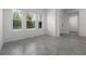 Bright, tiled living room with large windows offering views and a neutral color palette at 6458 Pine Warbler Way, St Cloud, FL 34771