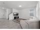 Comfortable living room with sleek fireplace and a white leather sectional couch at 6458 Pine Warbler Way, St Cloud, FL 34771