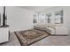 Inviting living room with neutral tones, a large area rug, a comfortable sofa, and plenty of natural light at 6458 Pine Warbler Way, St Cloud, FL 34771