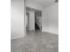 Spacious living area with tile flooring, neutral walls, and open access to stairs and other rooms at 6458 Pine Warbler Way, St Cloud, FL 34771
