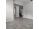 Spacious living area with tile flooring, neutral walls, and open access to stairs and other rooms at 6458 Pine Warbler Way, St Cloud, FL 34771