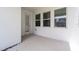 Bright patio with ample windows and a door, ideal for enjoying outdoor living at 6458 Pine Warbler Way, St Cloud, FL 34771