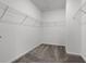 Spacious walk-in closet featuring wire shelving for easy organization at 6458 Pine Warbler Way, St Cloud, FL 34771