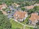 Scenic aerial view of Hidden Springs condominiums featuring lush landscaping, ample parking, and well-maintained buildings at 698 Roaring Dr # 382, Altamonte Springs, FL 32714