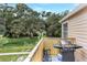 Relaxing balcony with a grill, seating, and a view of the lush green landscape at 698 Roaring Dr # 382, Altamonte Springs, FL 32714