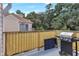 Balcony featuring outdoor grill and seating, with scenic views of the surrounding greenery at 698 Roaring Dr # 382, Altamonte Springs, FL 32714
