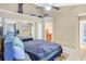 Bedroom boasting a ceiling fan, mirrored closet, and a view of the bathroom entry for added convenience at 698 Roaring Dr # 382, Altamonte Springs, FL 32714