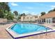 Inviting community pool area with lounge chairs and tables at Hidden Springs, ideal for enjoying sunny days at 698 Roaring Dr # 382, Altamonte Springs, FL 32714
