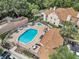 Aerial view of the community pool, hot tub, and lounge area at Hidden Springs, perfect for relaxation and socializing at 698 Roaring Dr # 382, Altamonte Springs, FL 32714