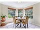 Charming breakfast nook with large windows offering a view of the surrounding greenery at 698 Roaring Dr # 382, Altamonte Springs, FL 32714
