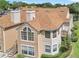 Charming exterior of Hidden Springs condominium showcasing architectural details, windows, and well-kept landscaping at 698 Roaring Dr # 382, Altamonte Springs, FL 32714