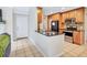 Modern kitchen with granite countertops, stainless steel appliances, and a convenient breakfast bar at 698 Roaring Dr # 382, Altamonte Springs, FL 32714