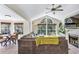 Spacious living room with ample seating, large windows, and a view of the adjacent dining area at 698 Roaring Dr # 382, Altamonte Springs, FL 32714
