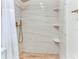 A modern walk-in shower with sleek shower fixtures and built in shelves for optimal storage at 698 Roaring Dr # 382, Altamonte Springs, FL 32714
