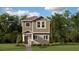 Charming two-story home with neutral color palette, a covered porch and a well maintained lawn at 7227 Sienna Oak Aly, Orlando, FL 32829