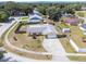 Take a look at this property with its large driveway and the surrounding neighborhood from an aerial view at 7750 Murcott Cir, Orlando, FL 32835