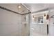 Bathroom featuring a shower with glass door and a vanity with drawers and cabinets at 7750 Murcott Cir, Orlando, FL 32835