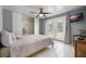 This bedroom has bright lighting, a ceiling fan, closet, and doors that lead to the backyard at 7750 Murcott Cir, Orlando, FL 32835