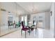 Elegant dining room with mirrored walls, a chandelier, and stylish seating for eight at 7750 Murcott Cir, Orlando, FL 32835
