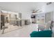 Open living space featuring modern decor, a breakfast bar, and plenty of room to entertain at 7750 Murcott Cir, Orlando, FL 32835