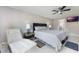 Relaxing main bedroom featuring tiled flooring, natural light, and a calm color palette at 7750 Murcott Cir, Orlando, FL 32835