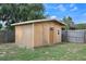 This shed is newly constructed and features a single door and window at 7750 Murcott Cir, Orlando, FL 32835