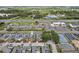 Aerial view of townhomes, tennis courts and proximity to shopping, dining and major roads at 8801 Crayson Ct, Kissimmee, FL 34747
