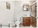 Bathroom with wooden cabinet and granite countertop and a glass shower with tilework at 8801 Crayson Ct, Kissimmee, FL 34747