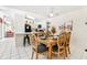 Inviting dining area adjacent to the kitchen, featuring a wooden table with seating for six, ideal for Gathering meals and gatherings at 8801 Crayson Ct, Kissimmee, FL 34747