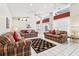 Bright living space with multiple sofas, tile flooring, and large windows, creating an open and inviting atmosphere for gatherings at 8801 Crayson Ct, Kissimmee, FL 34747