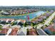 Aerial view showcases this beautiful two-story home, nestled in a vibrant community with scenic views of the surrounding lakes at 10427 Royal Cypress Way, Orlando, FL 32836