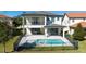 This property features a private backyard oasis with a pool, patio, and lush landscaping, perfect for relaxation and entertainment at 10427 Royal Cypress Way, Orlando, FL 32836